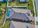 Top-down view of a home with a private pool in the backyard at 962 Compass Landing Dr, Orange City, FL 32763