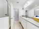 Bright bathroom boasts a walk-in shower and modern vanity at 962 Compass Landing Dr, Orange City, FL 32763