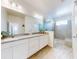 Spa-like bathroom with a double vanity, large shower, and modern fixtures at 962 Compass Landing Dr, Orange City, FL 32763