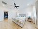 Main bedroom with walk-in closet and ceiling fan at 962 Compass Landing Dr, Orange City, FL 32763
