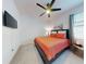 Guest bedroom with king-size bed and ceiling fan at 962 Compass Landing Dr, Orange City, FL 32763