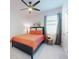 Bedroom with a king-size bed and ceiling fan at 962 Compass Landing Dr, Orange City, FL 32763