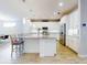 Modern kitchen with white cabinets, stainless steel appliances, and a large island at 962 Compass Landing Dr, Orange City, FL 32763