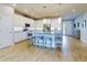 Modern kitchen with white cabinets, stainless steel appliances, and a large island at 962 Compass Landing Dr, Orange City, FL 32763