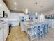 Modern kitchen with white cabinets, stainless steel appliances, and a large island at 962 Compass Landing Dr, Orange City, FL 32763