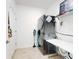 Bright laundry room with stackable washer and dryer, and folding table at 962 Compass Landing Dr, Orange City, FL 32763