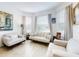 Living room with light beige sofas and large windows providing ample natural light at 962 Compass Landing Dr, Orange City, FL 32763