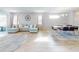 Open concept living and dining area with light flooring and large windows at 962 Compass Landing Dr, Orange City, FL 32763