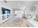 Spacious living room with a comfy sectional sofa and sliding glass doors leading to the backyard at 962 Compass Landing Dr, Orange City, FL 32763