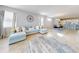 Open concept living and dining area with light flooring and large windows at 962 Compass Landing Dr, Orange City, FL 32763