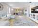 Open living room and dining area with light and airy feel, and hardwood floors at 962 Compass Landing Dr, Orange City, FL 32763