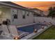Relaxing pool area with lounge chairs and fire bowls at sunset at 962 Compass Landing Dr, Orange City, FL 32763