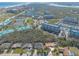 Community aerial view highlighting proximity to waterfront condos, boat marina, and beach access at 123 Ponce Terrace Cir, Ponce Inlet, FL 32127