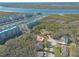 Waterfront condos and homes aerial view, complete with boat marina and surrounding natural landscapes at 123 Ponce Terrace Cir, Ponce Inlet, FL 32127