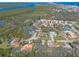 Neighborhood aerial view featuring lush greenery and a mix of single-Gathering homes and river views at 123 Ponce Terrace Cir, Ponce Inlet, FL 32127