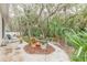 Landscaped backyard with stone pathway and lush foliage at 123 Ponce Terrace Cir, Ponce Inlet, FL 32127