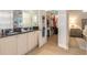Bathroom with double vanity and walk-in closet access at 123 Ponce Terrace Cir, Ponce Inlet, FL 32127