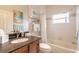 Bathroom with a bathtub, shower, and dark vanity at 123 Ponce Terrace Cir, Ponce Inlet, FL 32127