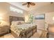 King-size bed, tropical bedding, and access to a balcony at 123 Ponce Terrace Cir, Ponce Inlet, FL 32127