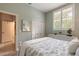 Bright bedroom with a queen-size bed and built-in closet at 123 Ponce Terrace Cir, Ponce Inlet, FL 32127