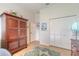 Bedroom with wood wardrobe, white closet doors, and coastal decor at 123 Ponce Terrace Cir, Ponce Inlet, FL 32127