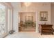 Elegant entryway with chandelier and view to dining area at 123 Ponce Terrace Cir, Ponce Inlet, FL 32127