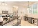 Modern kitchen with granite countertops, stainless steel appliances, and breakfast bar at 123 Ponce Terrace Cir, Ponce Inlet, FL 32127