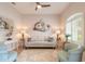 Comfortable living room with light-colored sofa and armchairs at 123 Ponce Terrace Cir, Ponce Inlet, FL 32127