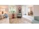 Relaxing living room with light-colored sofa and access to other rooms at 123 Ponce Terrace Cir, Ponce Inlet, FL 32127