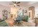 Relaxing living room, featuring a teal sofa and a painted octopus coffee table at 123 Ponce Terrace Cir, Ponce Inlet, FL 32127