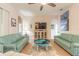 Comfortable living room with teal sofas and a stylish octopus coffee table at 123 Ponce Terrace Cir, Ponce Inlet, FL 32127