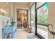 Bright screened porch features a view into the bedroom and backyard at 123 Ponce Terrace Cir, Ponce Inlet, FL 32127