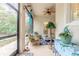 Spacious screened porch with ceiling fan and comfortable seating at 123 Ponce Terrace Cir, Ponce Inlet, FL 32127