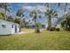 Backyard oasis with pool and lush landscaping at 130 Old Sunbeam Dr, South Daytona, FL 32119