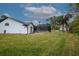 Home with fenced pool and lush green lawn at 130 Old Sunbeam Dr, South Daytona, FL 32119