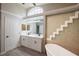 Bathroom with a modern double vanity and a bathtub at 130 Old Sunbeam Dr, South Daytona, FL 32119