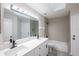 Bathroom features a double sink vanity, large mirror, and tile floor at 130 Old Sunbeam Dr, South Daytona, FL 32119