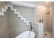 Spa-like bathroom with a walk-in shower and soaking tub at 130 Old Sunbeam Dr, South Daytona, FL 32119