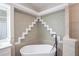 Bathroom with a freestanding bathtub and mosaic tile at 130 Old Sunbeam Dr, South Daytona, FL 32119