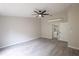 Spacious bedroom with ceiling fan and ensuite bathroom at 130 Old Sunbeam Dr, South Daytona, FL 32119