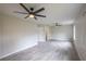 Bright bedroom with ceiling fan and large windows at 130 Old Sunbeam Dr, South Daytona, FL 32119