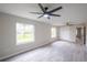 Large bedroom with ceiling fan and big windows at 130 Old Sunbeam Dr, South Daytona, FL 32119