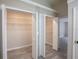 Large walk-in closet with shelving and hanging rods at 130 Old Sunbeam Dr, South Daytona, FL 32119