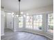 Modern dining area with large windows and chandelier at 130 Old Sunbeam Dr, South Daytona, FL 32119