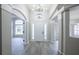Bright and airy entryway with high ceilings and wood-look tile at 130 Old Sunbeam Dr, South Daytona, FL 32119