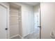Laundry room with shelving, storage, and tile flooring at 130 Old Sunbeam Dr, South Daytona, FL 32119