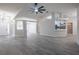 Open living room and kitchen with tile floors at 130 Old Sunbeam Dr, South Daytona, FL 32119