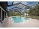 Inviting screened pool with ample surrounding space at 130 Old Sunbeam Dr, South Daytona, FL 32119