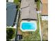 Aerial view of a private pool, brick patio, privacy fence, and screened in back porch at 1413 La Paloma Cir, Winter Springs, FL 32708