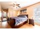 Spacious bedroom with a wooden sleigh bed and ample closet space at 1413 La Paloma Cir, Winter Springs, FL 32708